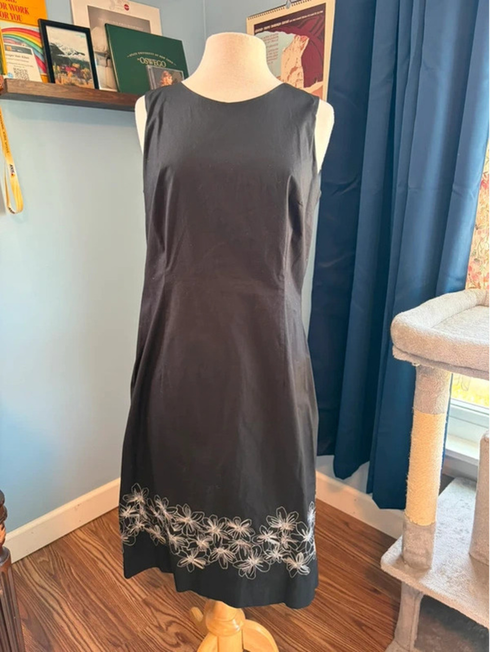 Black sheath dress with embroidered hem